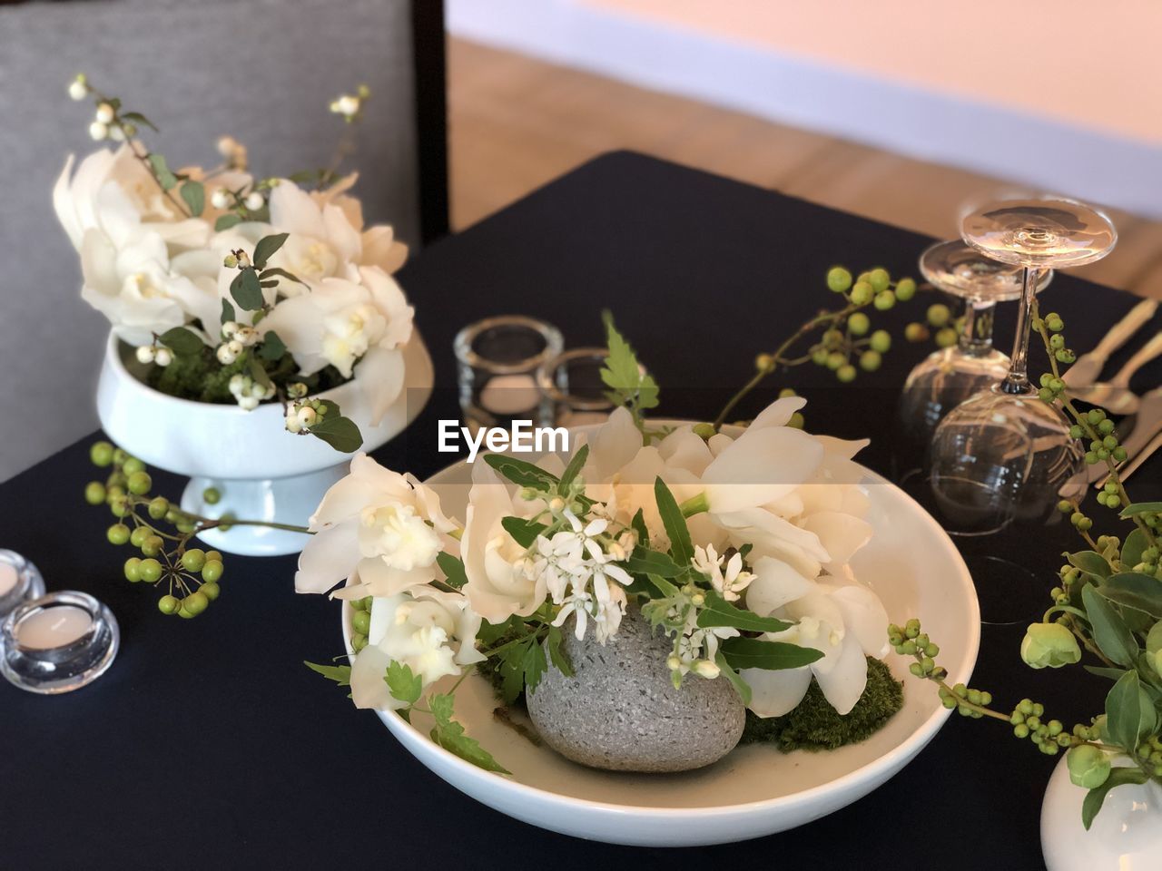 High angle view of white roses in vase on table