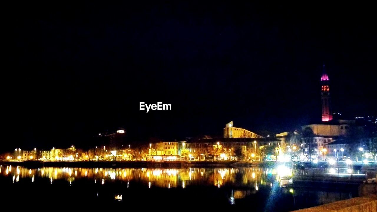 Reflection of illuminated buildings in water