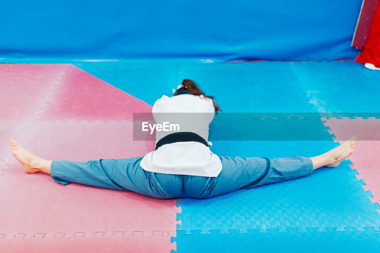 Full length of man lying on swimming pool