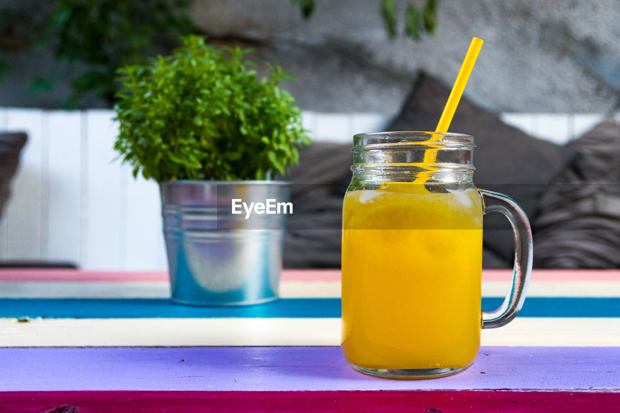 CLOSE-UP OF JUICE ON TABLE
