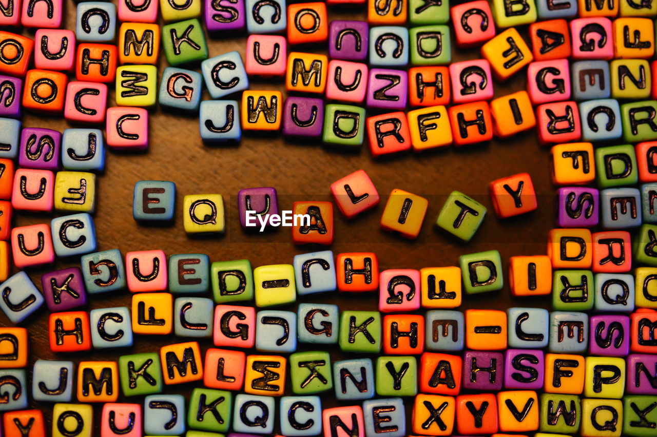 Directly above shot of multi colored letter blocks on table