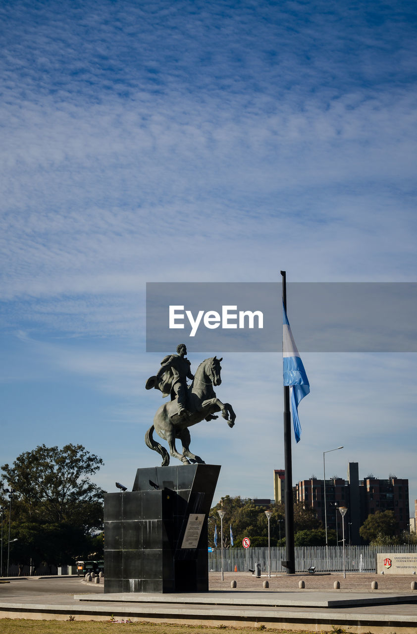 STATUE AGAINST SKY