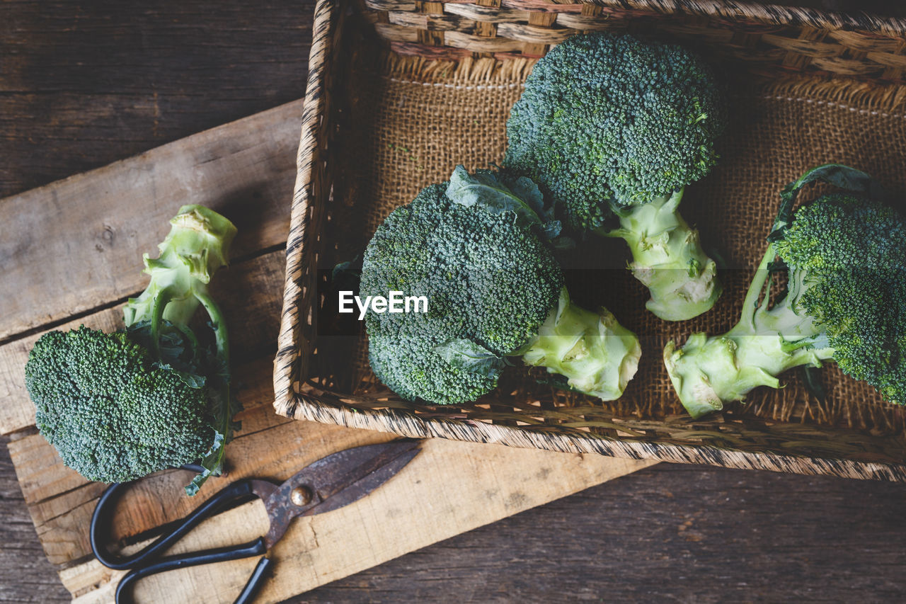 Close-up of broccolis on wooden table