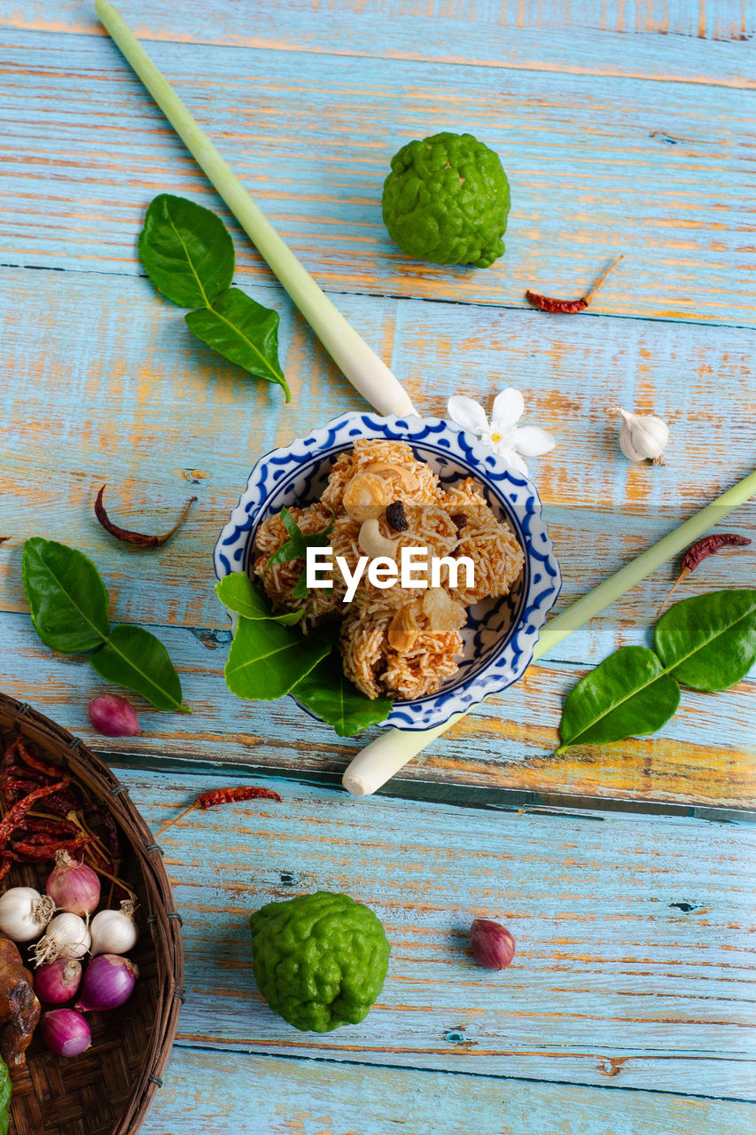 food and drink, food, wood, healthy eating, freshness, wellbeing, no people, studio shot, produce, high angle view, indoors, leaf, vegetable, fruit, spice, plant part, plant, sweet food, still life, herb, table, dish