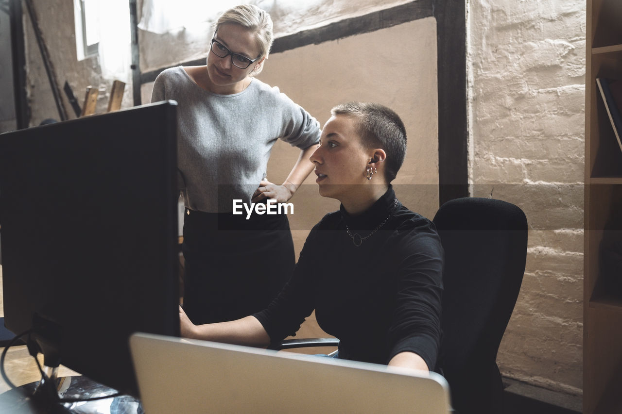 Businesswomen working on computer at workplace