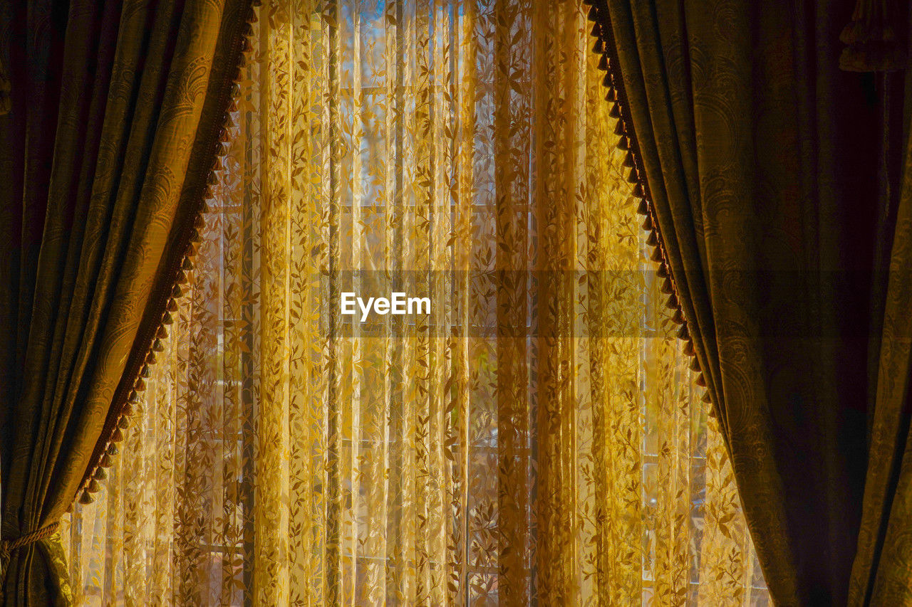 yellow, curtain, interior design, window treatment, no people, indoors, gold, textile, pattern, wood, window covering, sunlight, hanging, close-up