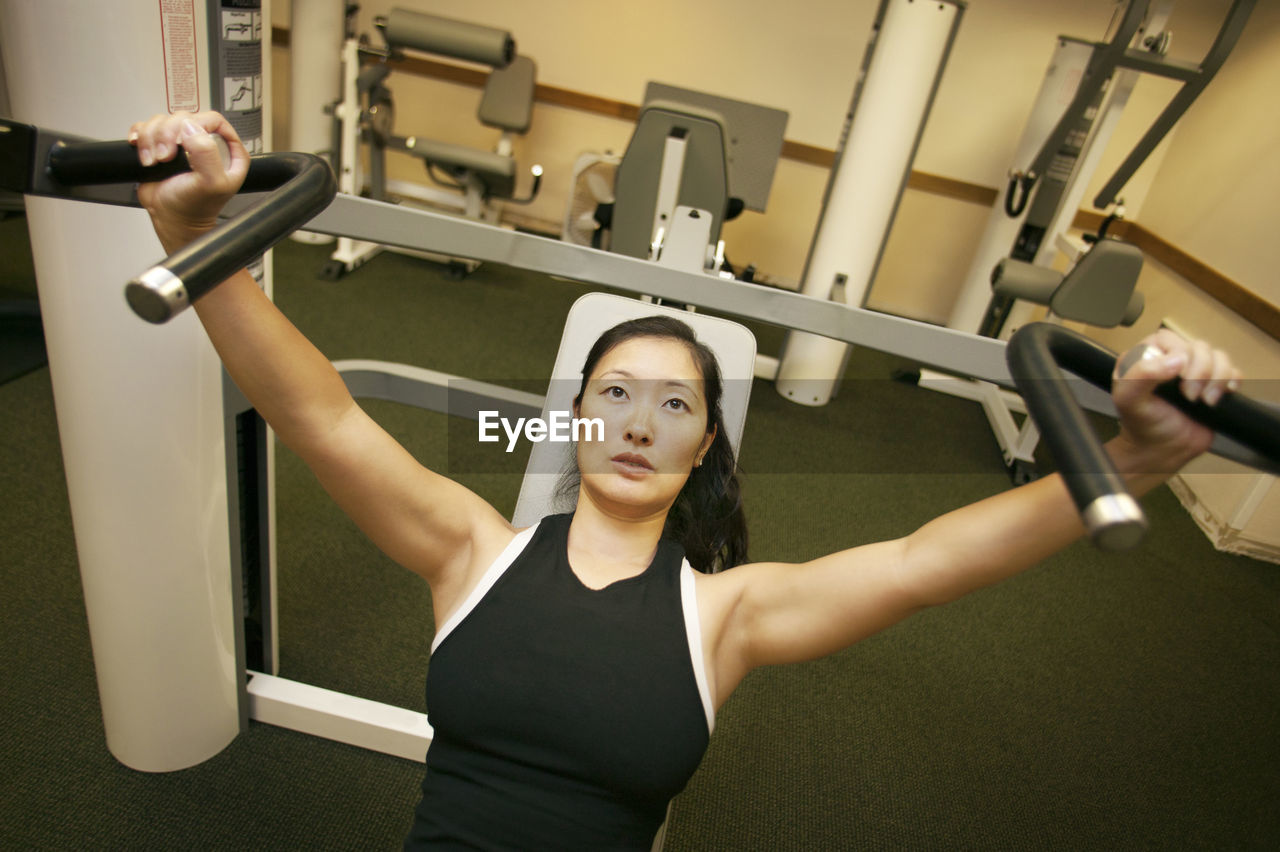 High angle view of woman exercising in gym