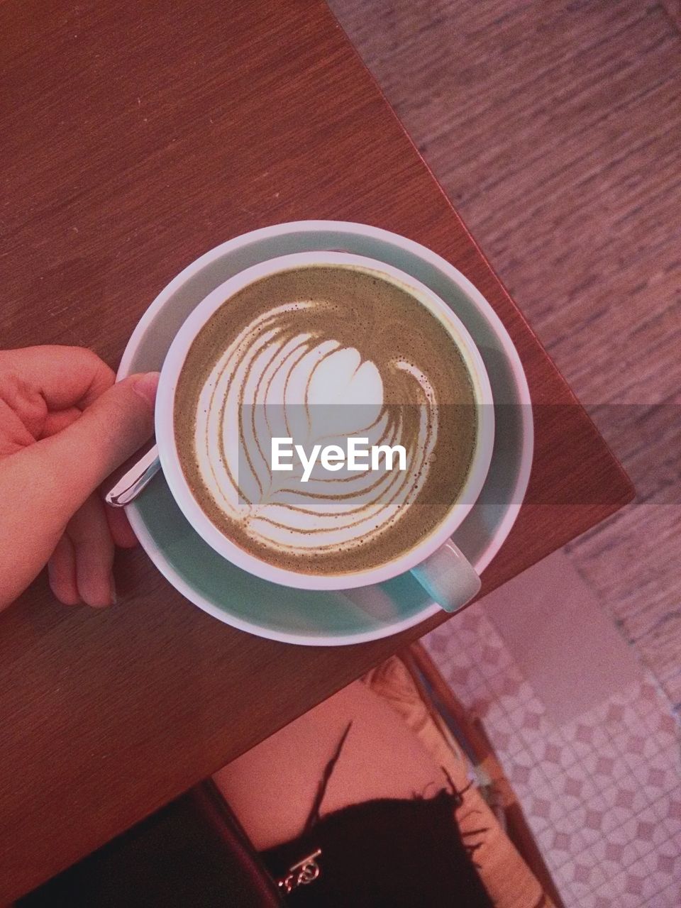 Directly above shot of cappuccino on wooden table