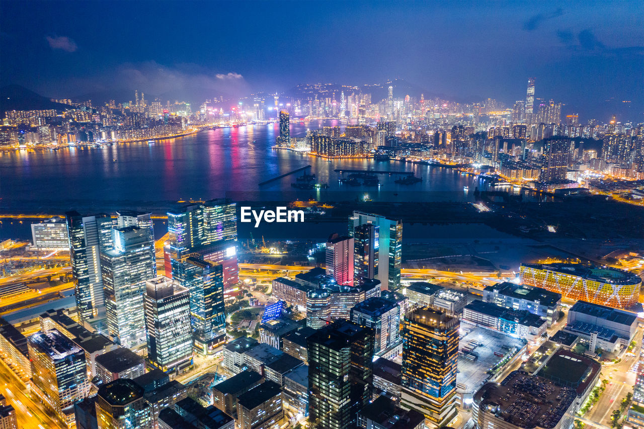 High angle view of illuminated city buildings at night