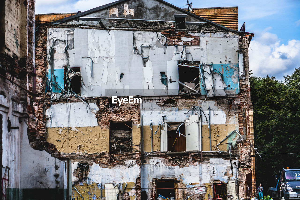 Damaged building against sky