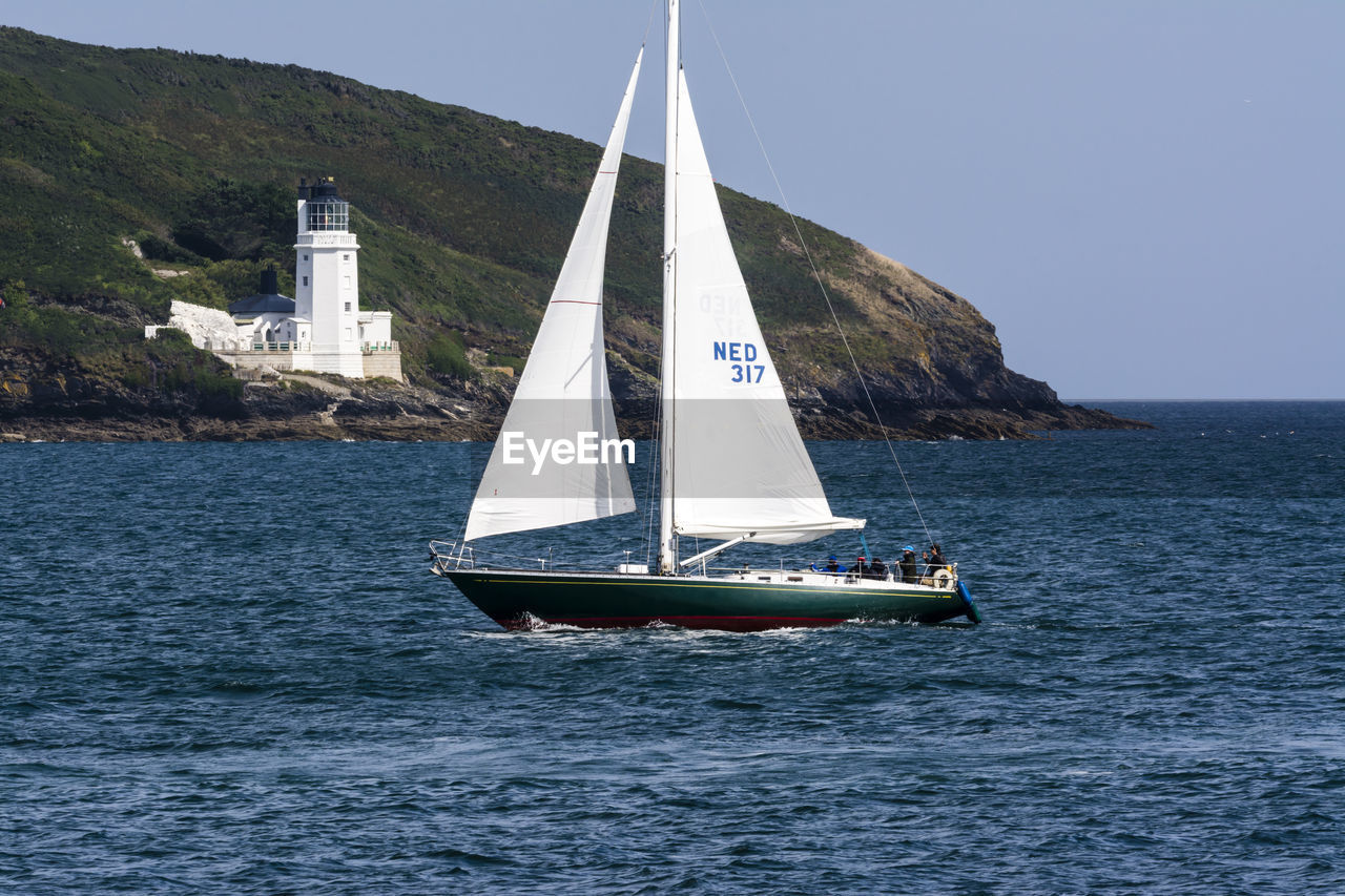 BOATS SAILING IN SEA