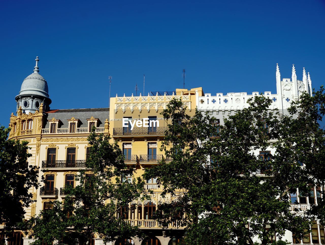 BUILDING AGAINST BLUE SKY