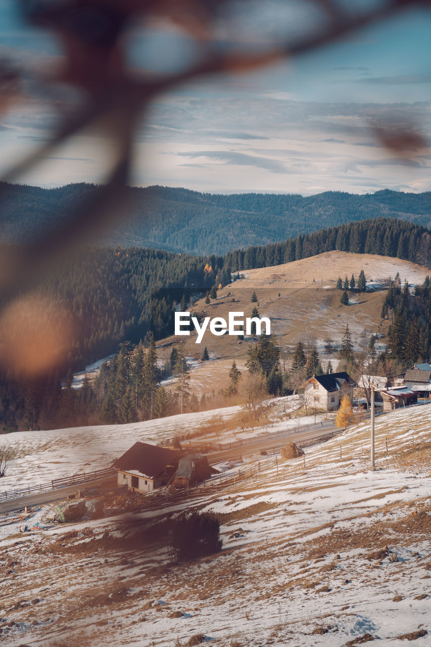 Scenic view of landscape against sky during winter