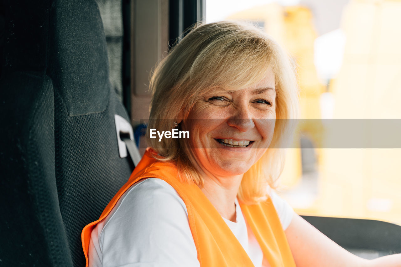 Portrait of happy driver in truck