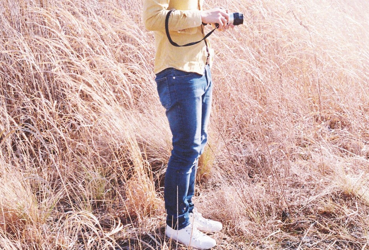 LOW SECTION OF MAN STANDING ON GROUND