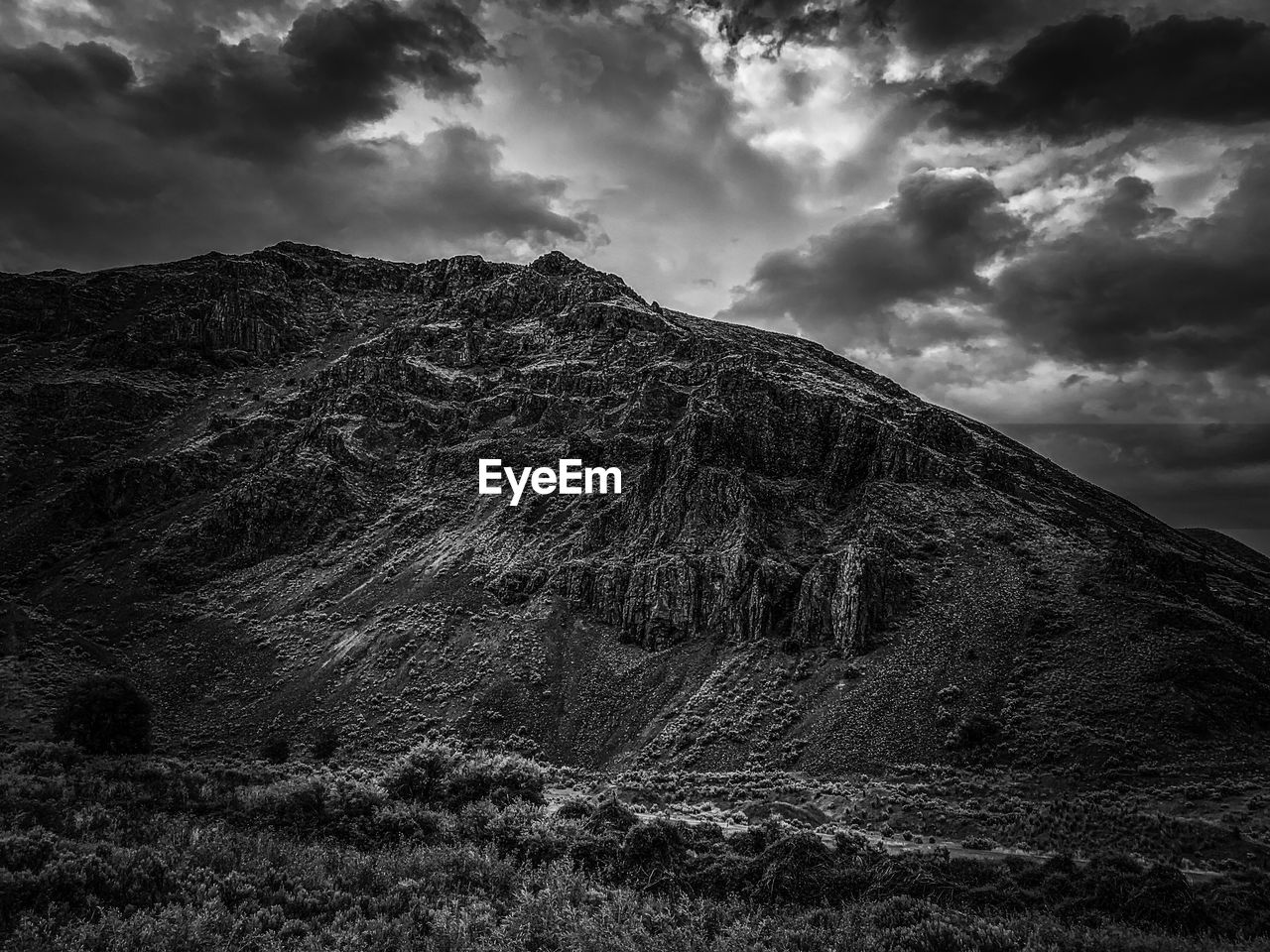 Low angle view of mountain range against sky