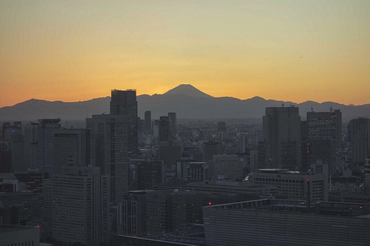 Silhouette of city at sunset