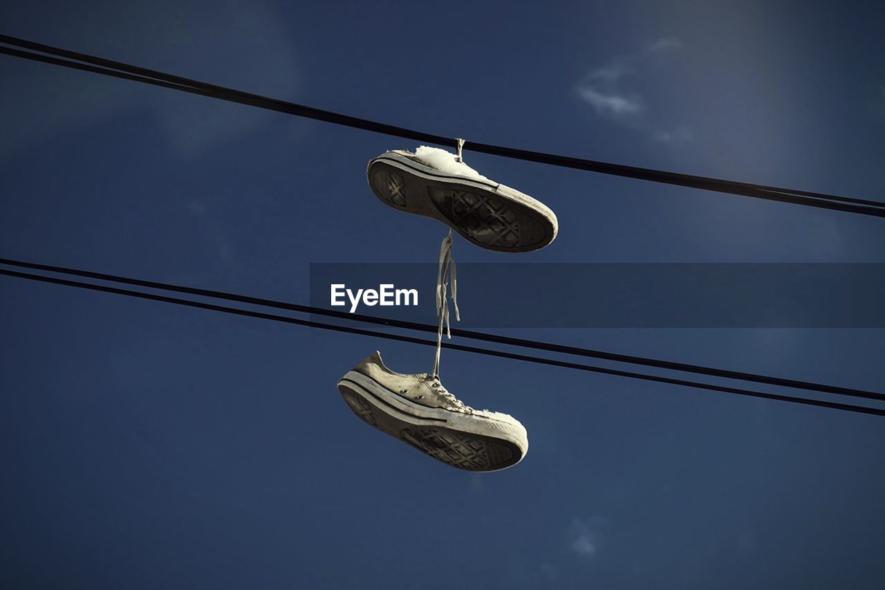 Converse shoes hanging from power lines