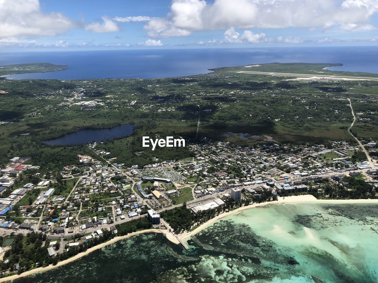 HIGH ANGLE VIEW OF CITY BY SEA