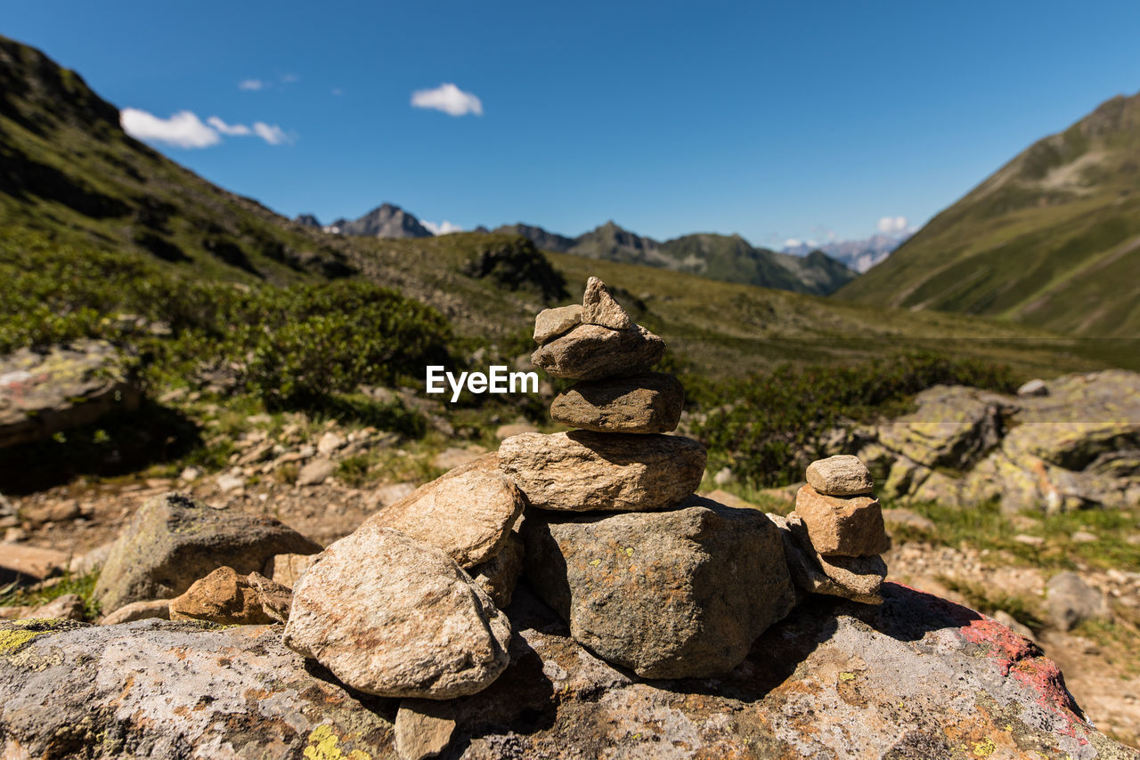 Stacked stones against mountain