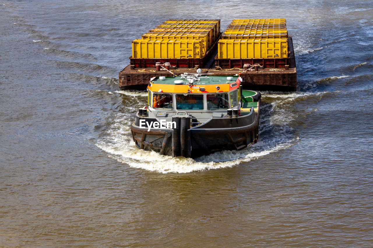 HIGH ANGLE VIEW OF TRADITIONAL SHIP SAILING ON SEA