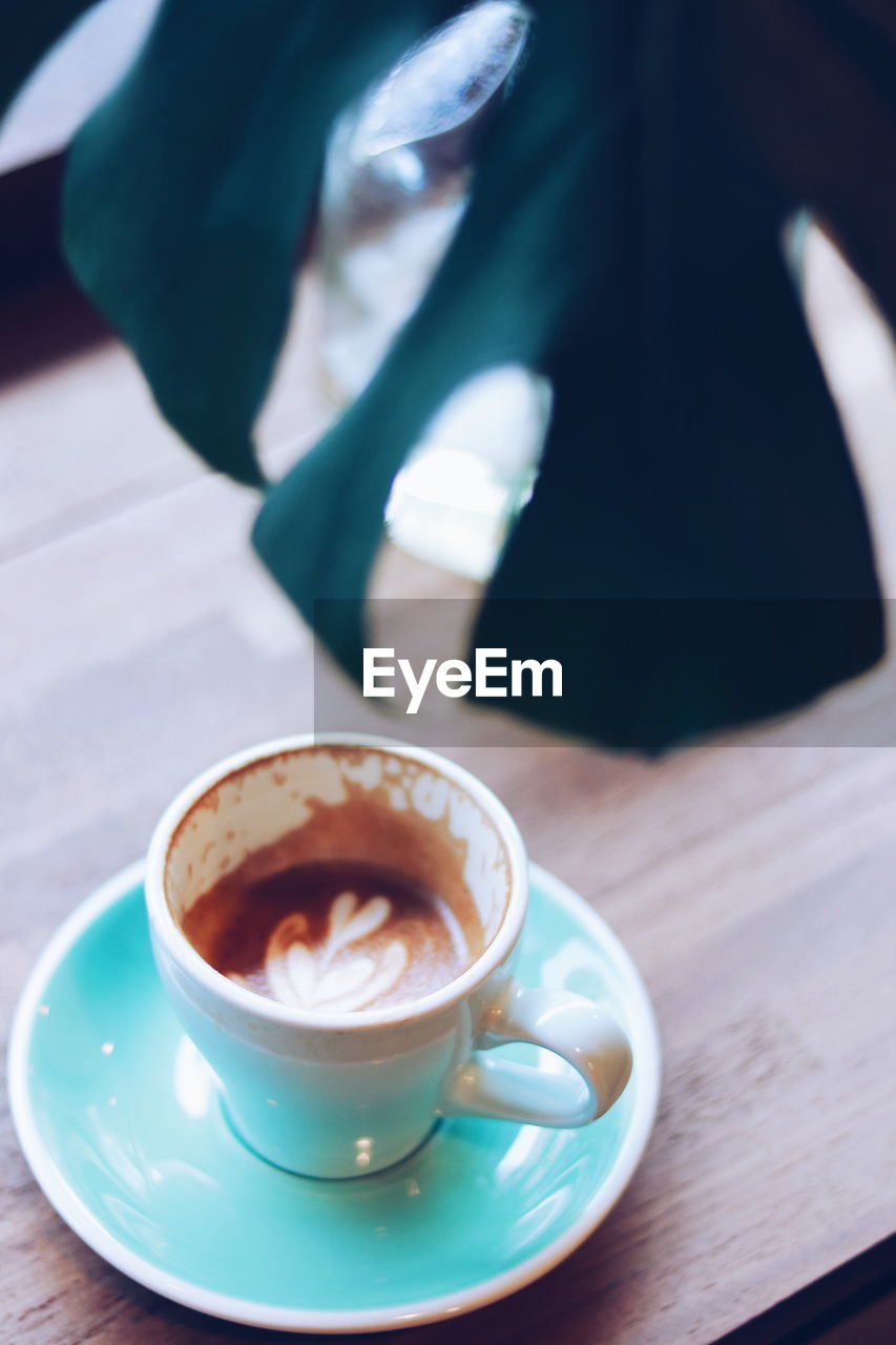 CLOSE-UP OF COFFEE ON TABLE