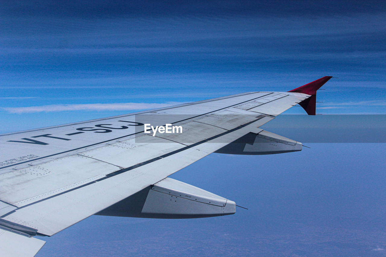 AERIAL VIEW OF AIRPLANE FLYING IN SKY