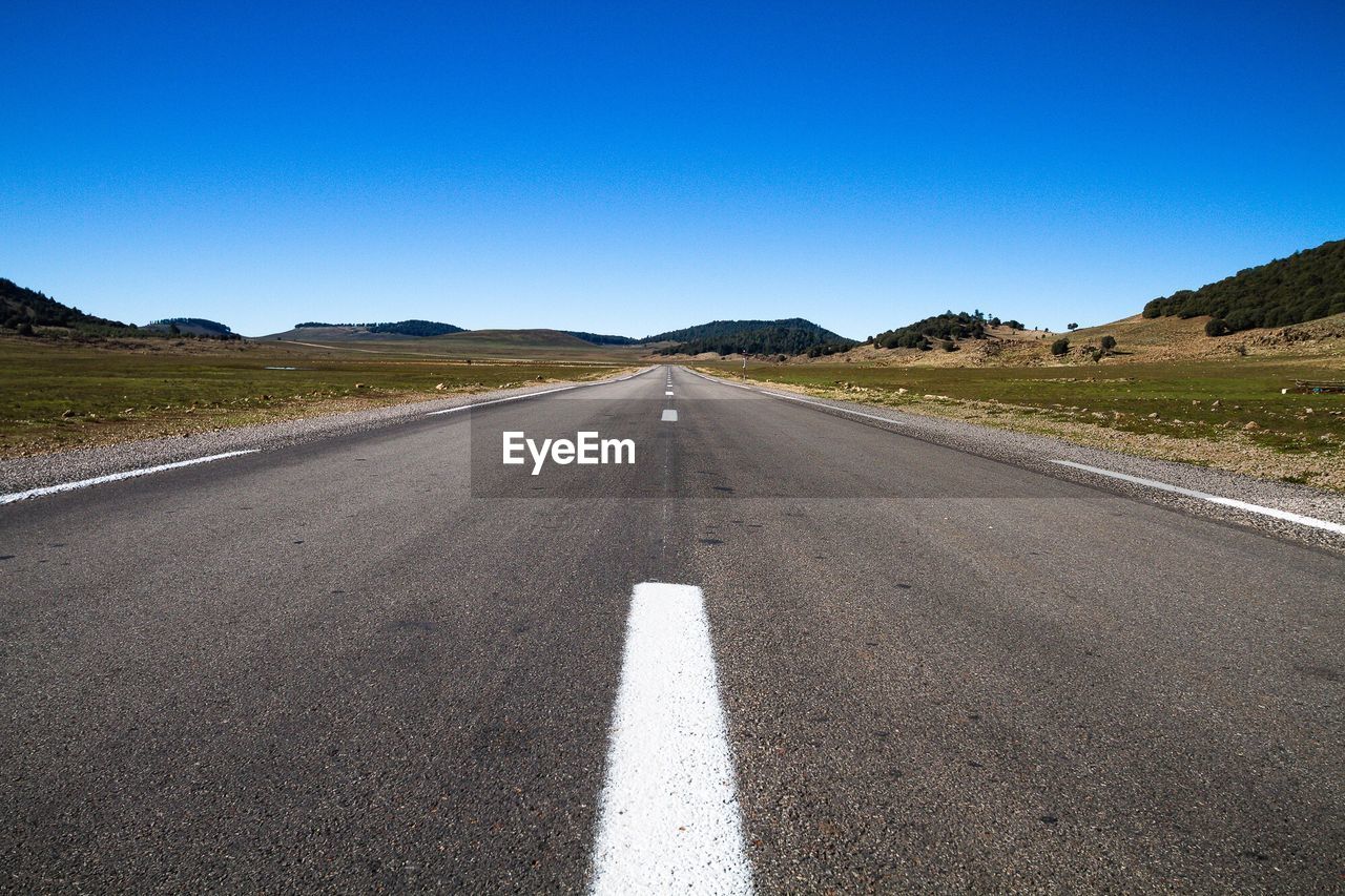 Empty road along landscape