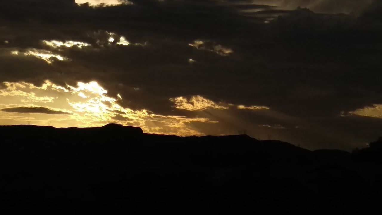 SILHOUETTE OF MOUNTAIN AT SUNSET
