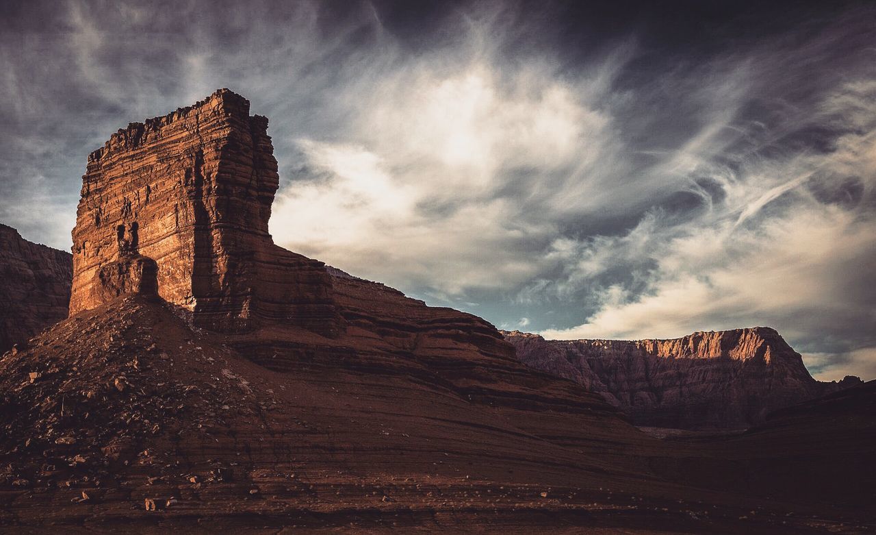 Rock formations on landscape against sky