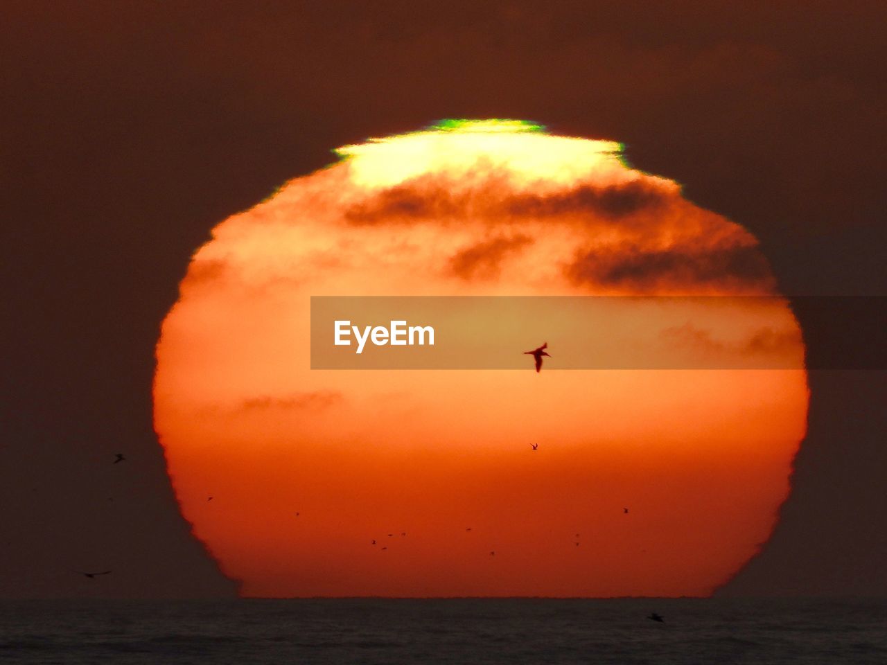 VIEW OF SEA AGAINST CLOUDY SKY