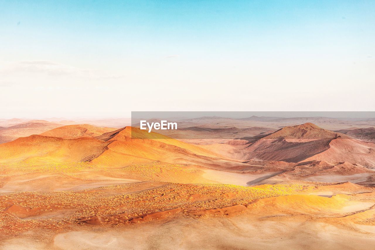 Scenic view of desert against clear sky