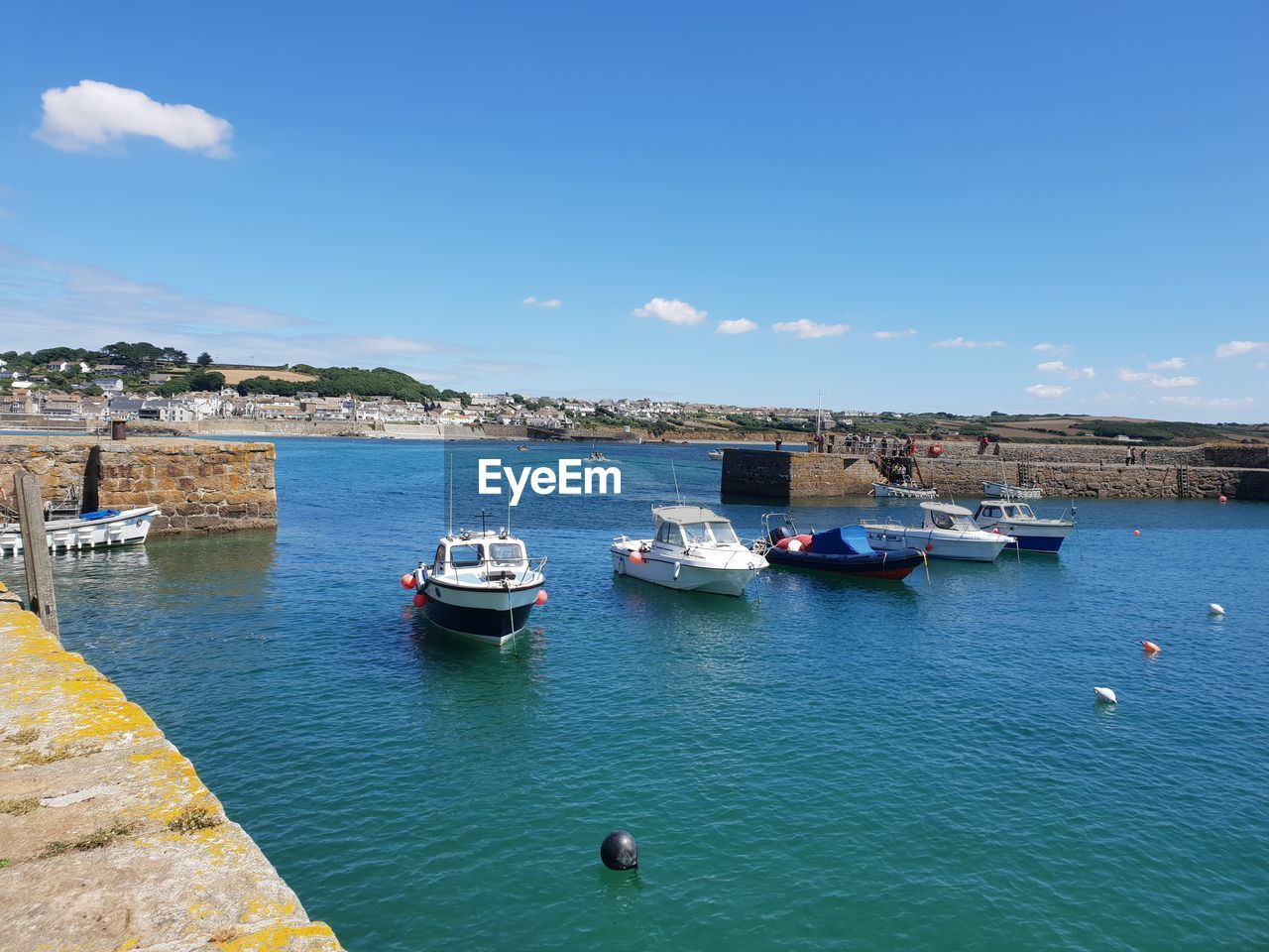 BOATS IN SEA AGAINST BLUE SKY