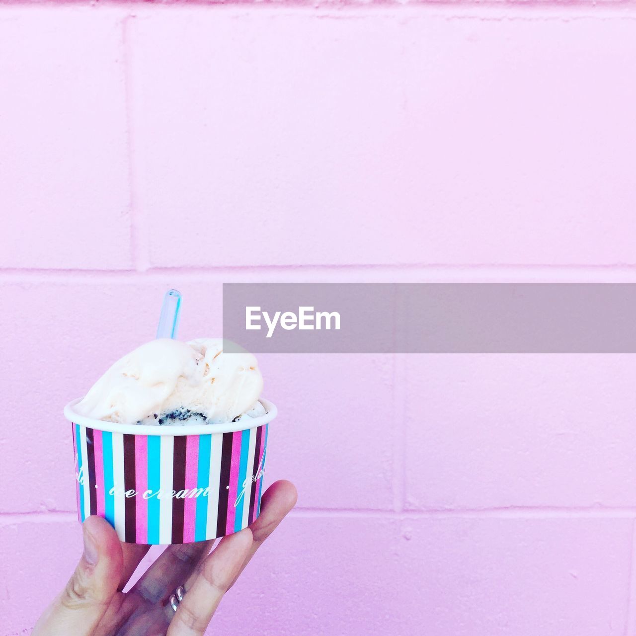 Close-up of hand holding ice cream