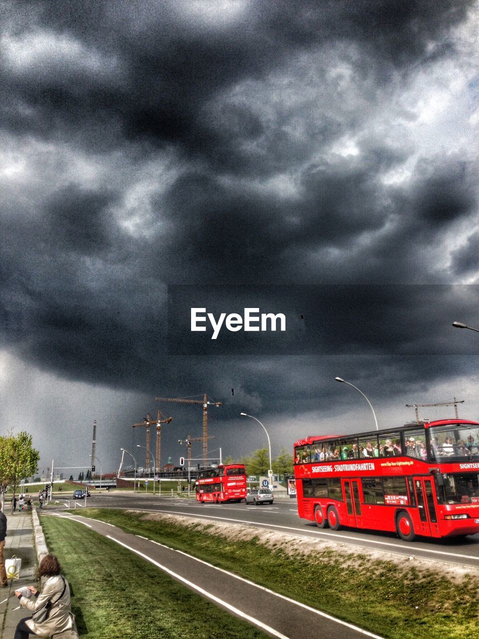 VIEW OF ROAD AGAINST CLOUDY SKY