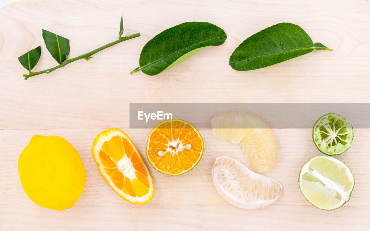 Directly above shot of various citrus fruits on table