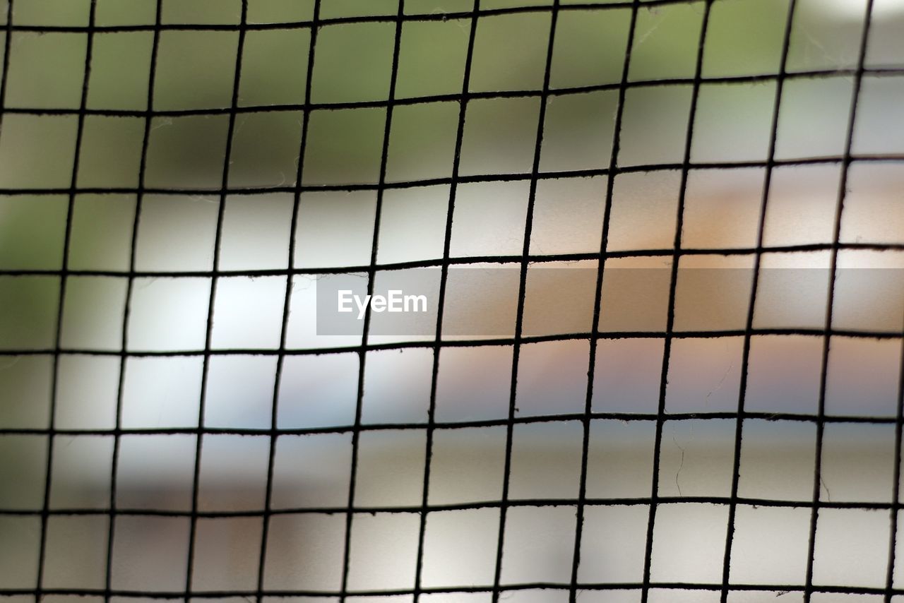 FULL FRAME SHOT OF SWIMMING POOL BY FENCE