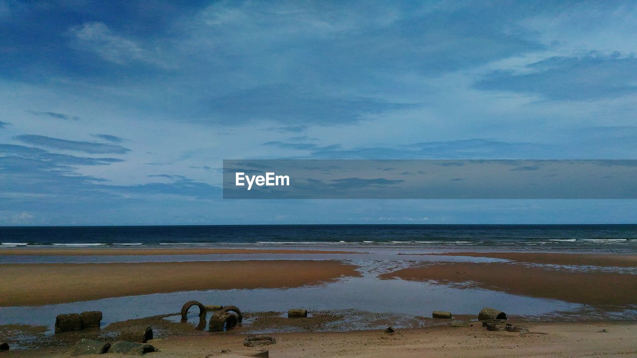 VIEW OF BEACH AGAINST SKY