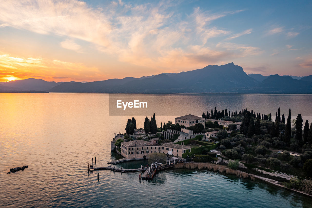 scenic view of lake against romantic sky during sunset