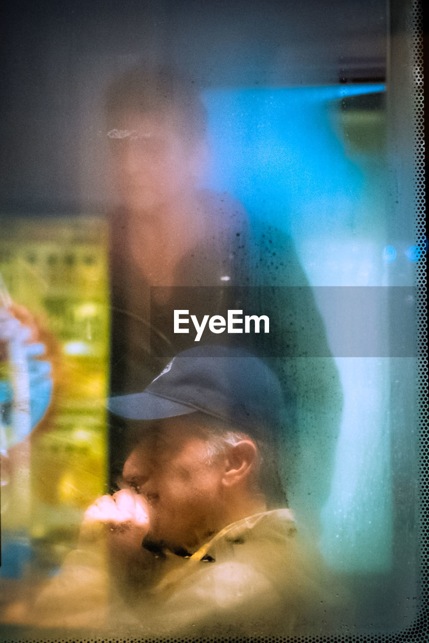 PORTRAIT OF WOMAN WITH GLASS WINDOW