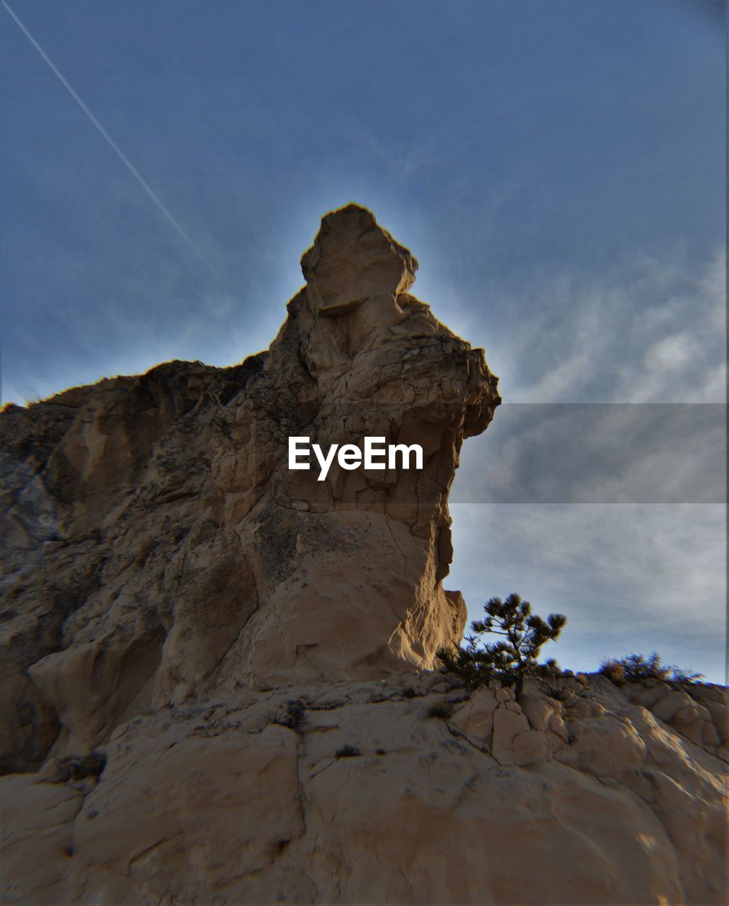 Low angle view of rocky mountains against sky