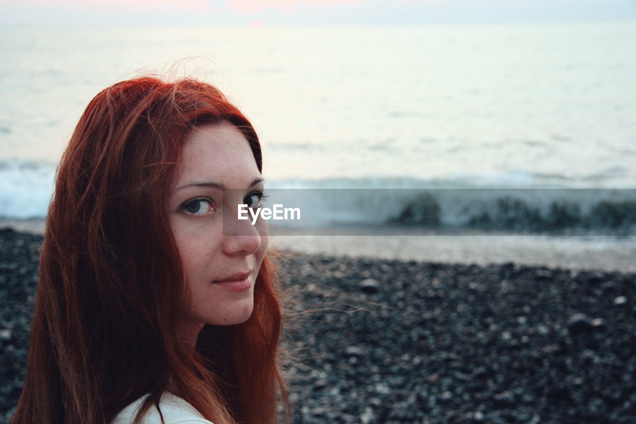 Portrait of beautiful young woman on beach