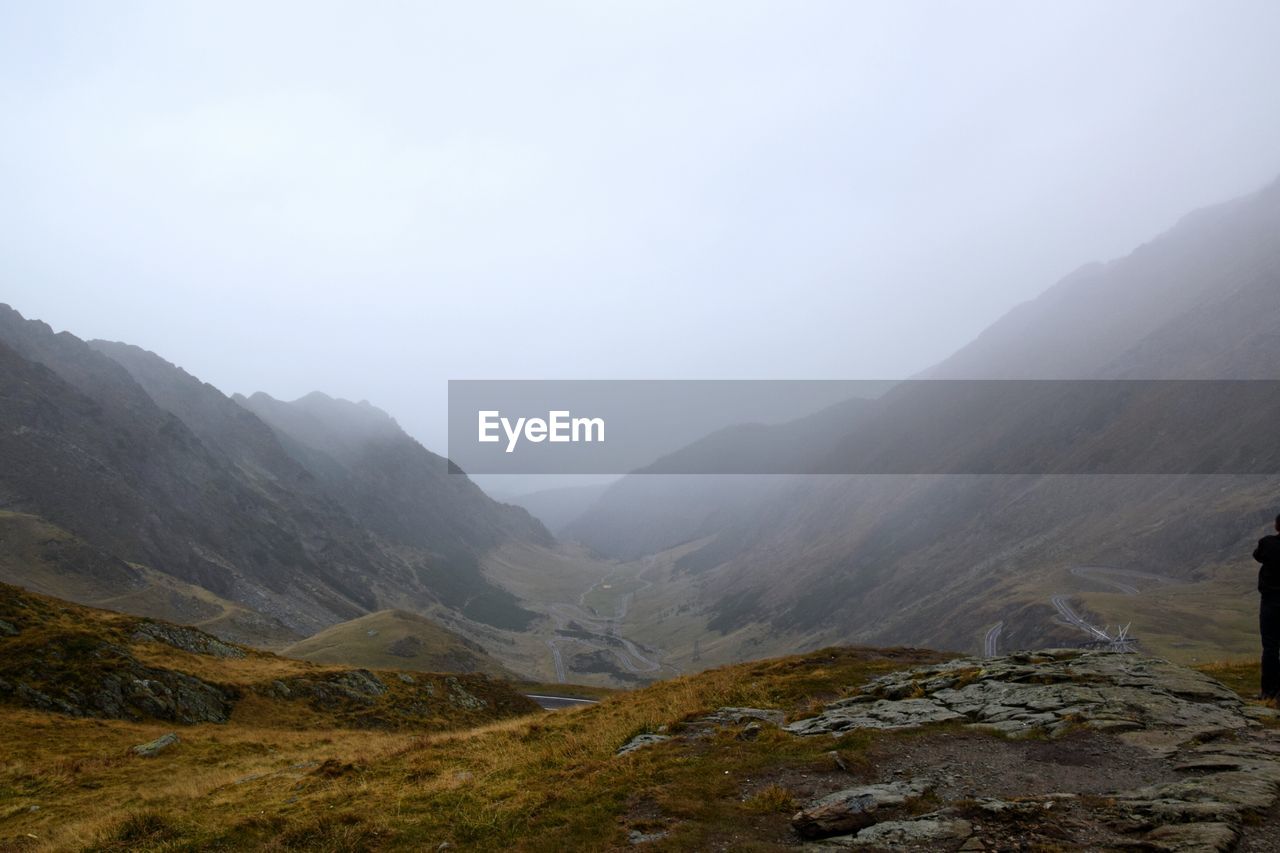 SCENIC VIEW OF MOUNTAINS AT FOGGY WEATHER