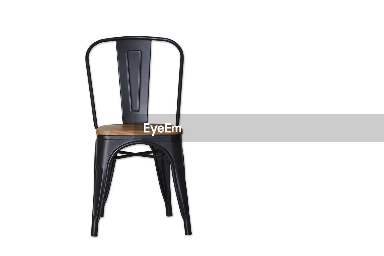 Empty chair against white background