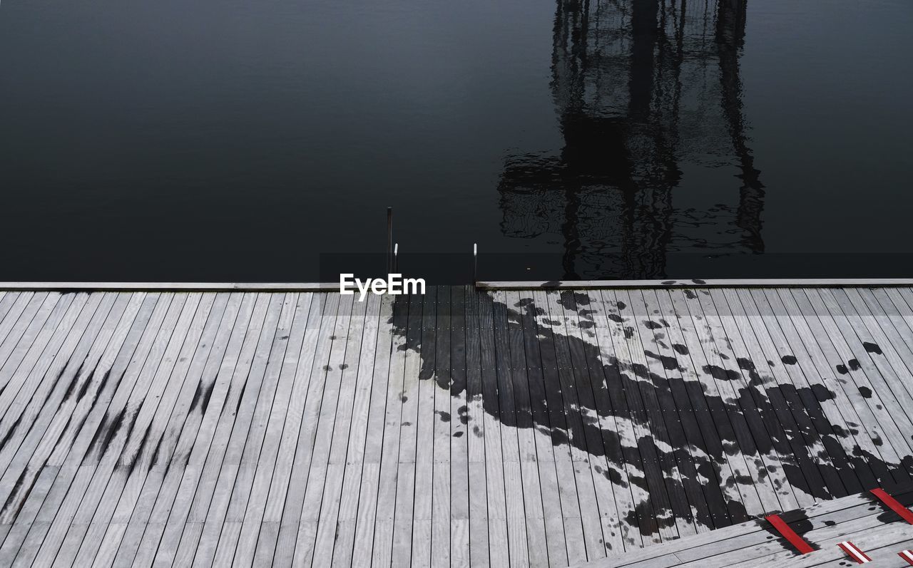 High angle view of reflection in lake during winter