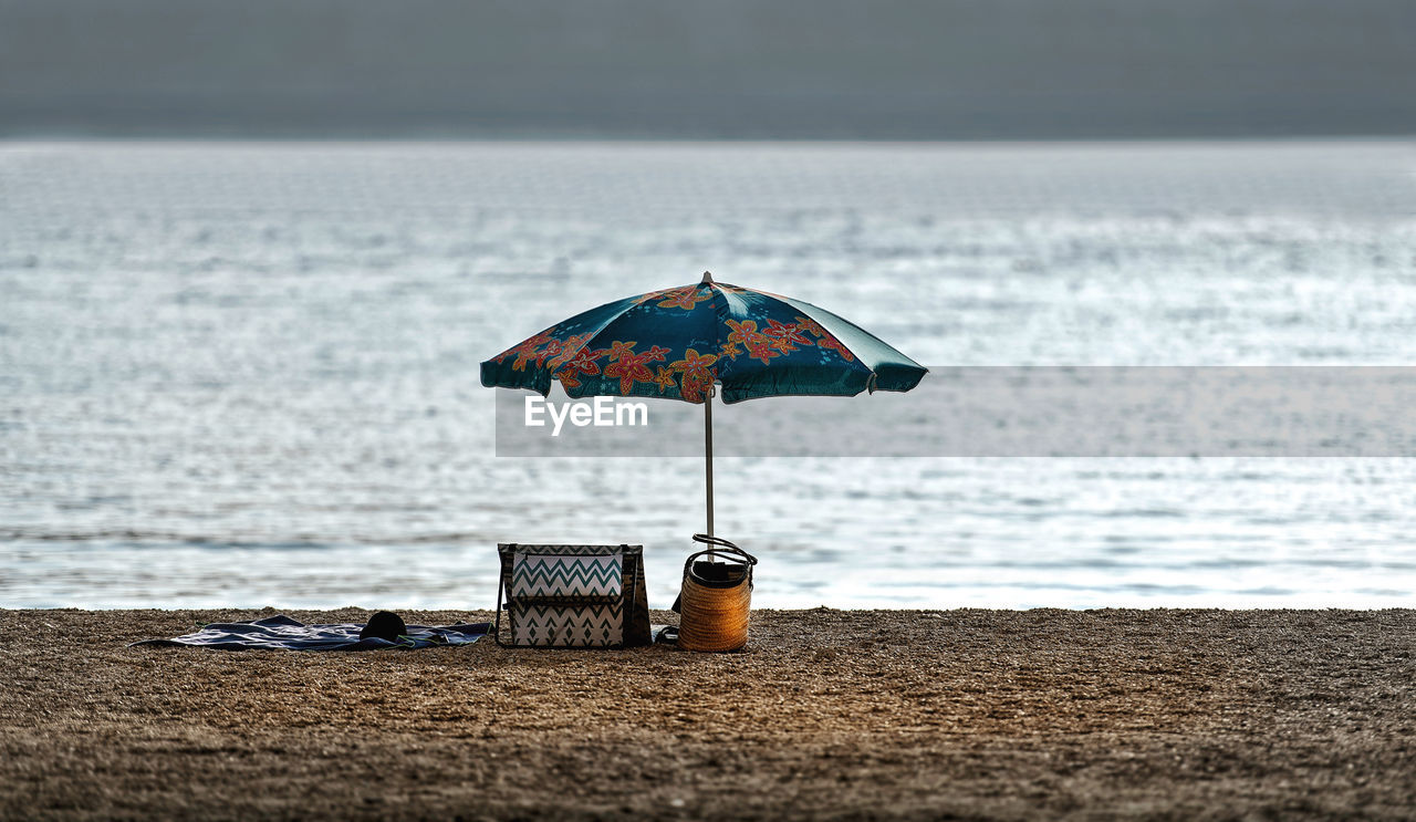 Umbrella on the beach against sea