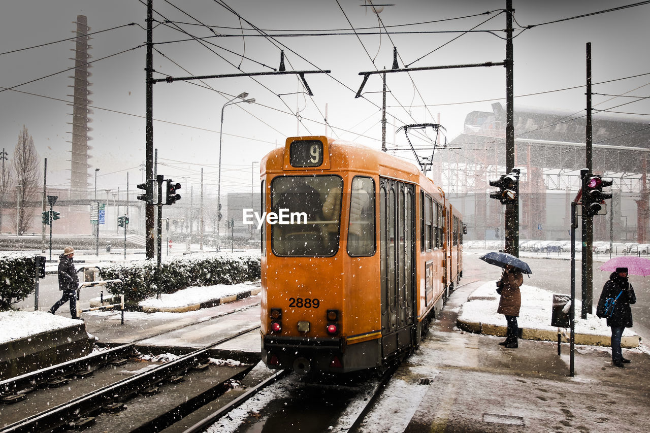 Train on railroad station platform during winter