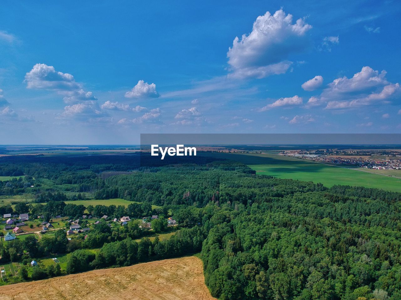 SCENIC VIEW OF LAND AND TREES AGAINST SKY