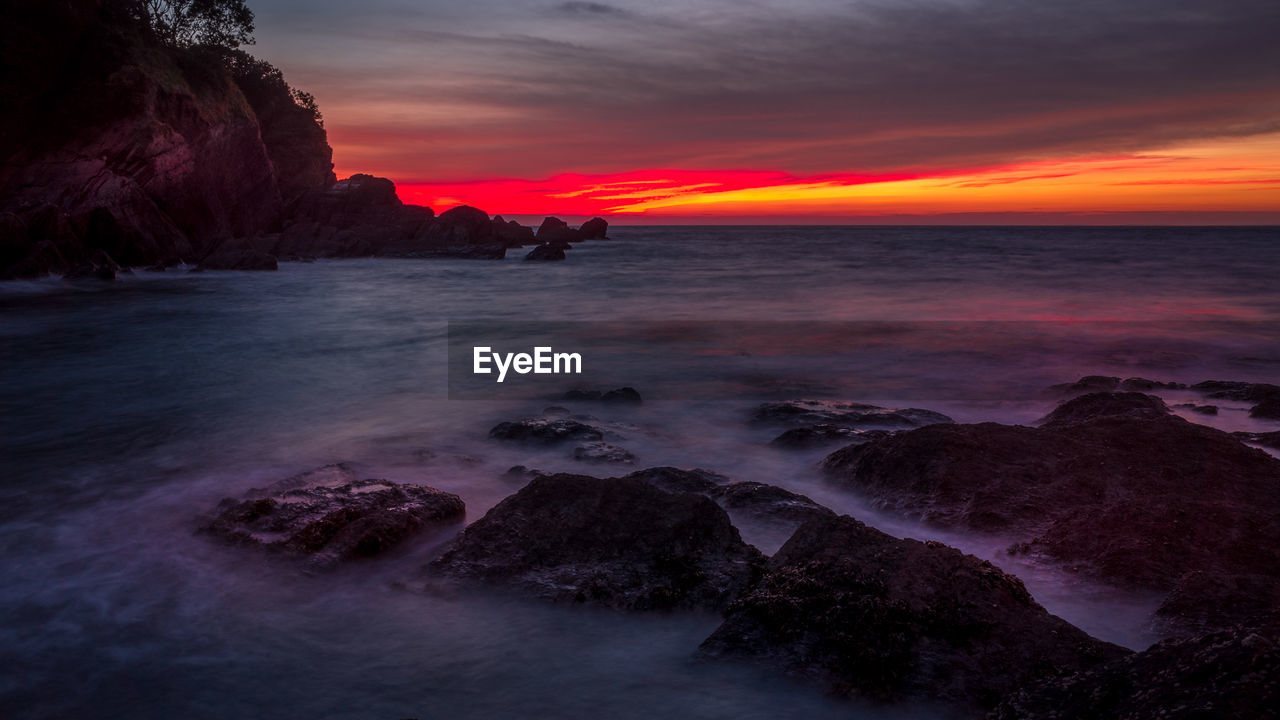 Scenic view of sea against sky during sunset