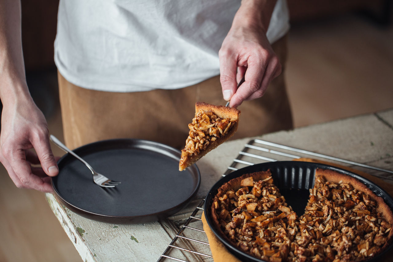 midsection of man preparing food on table